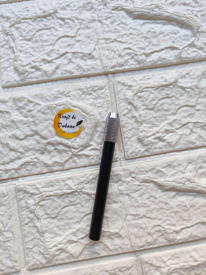 Black pencil extender close-up of textured metal grip cap
