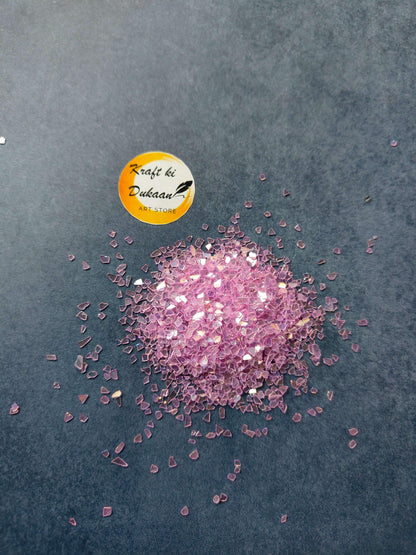 pink-resin-crystals-sparkling-pile-black-background