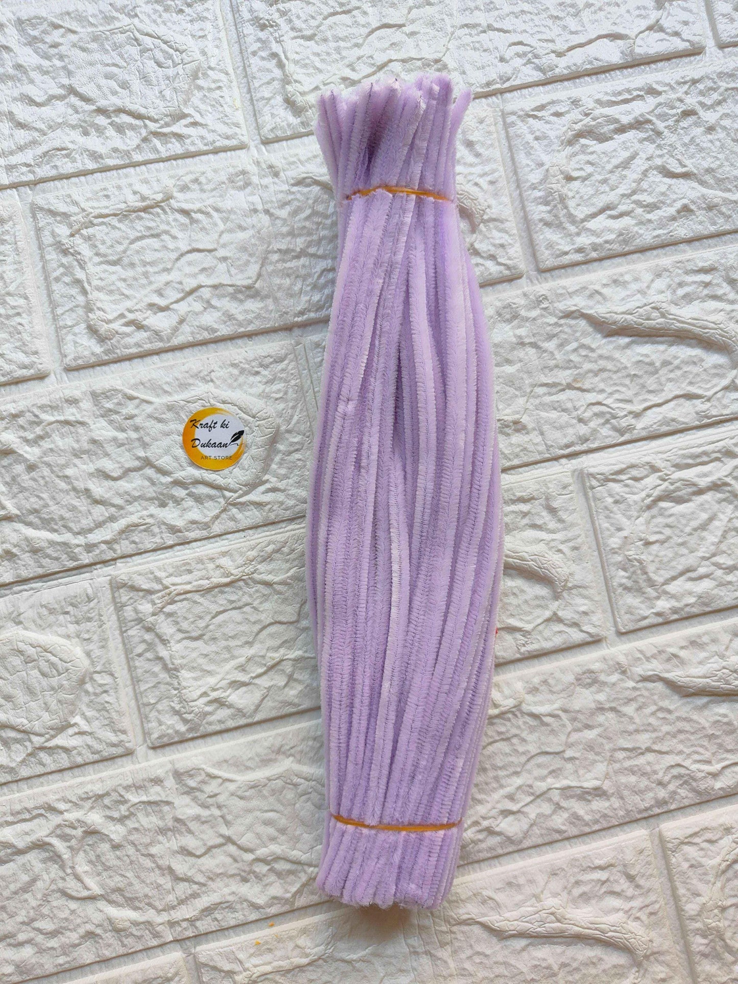 Pack of purple plain pipe cleaners made of fuzzy fabric for crafting and DIY projects