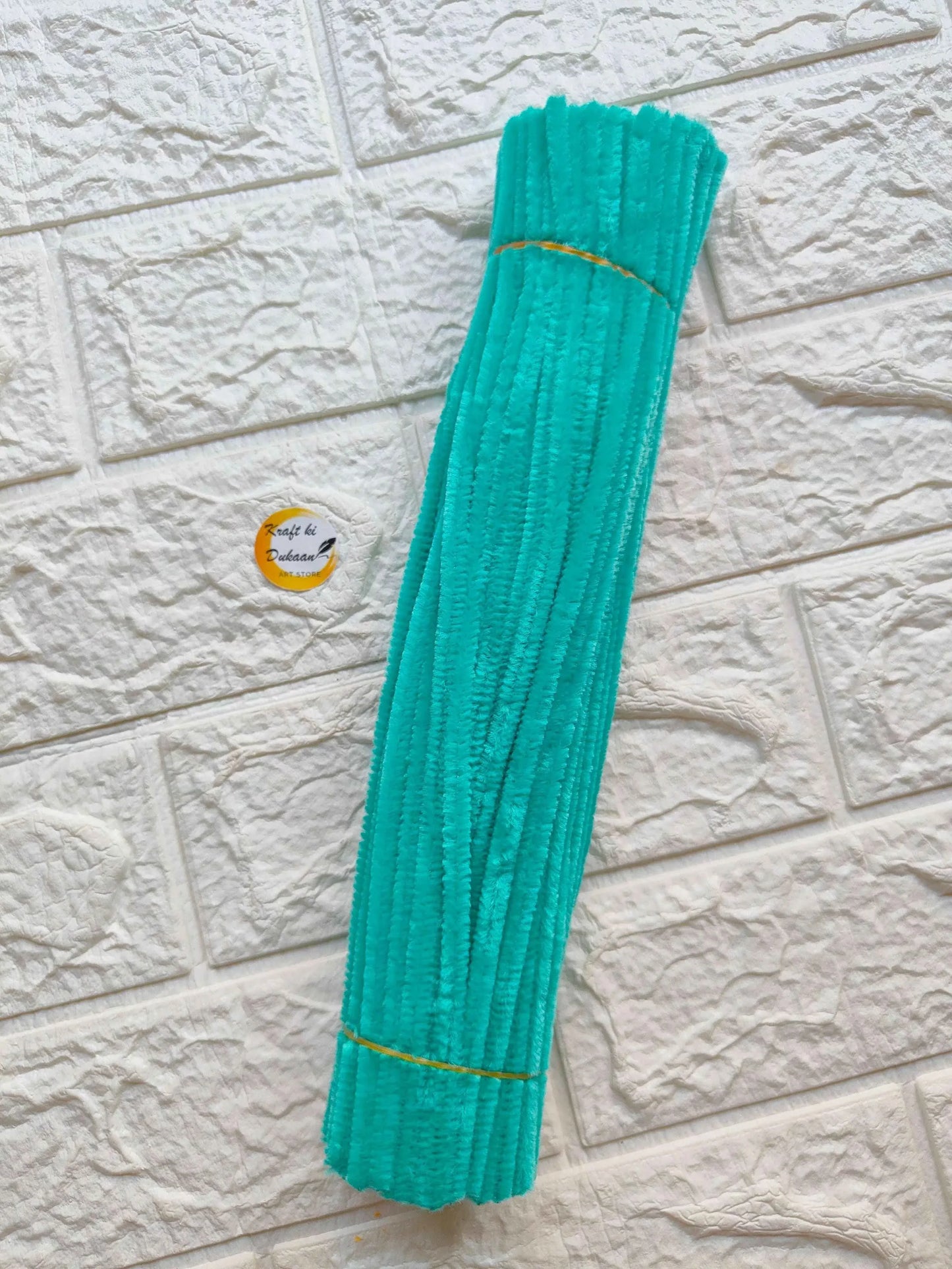Turquoise plain pipe cleaners made of soft material, ideal for crafts and DIY projects