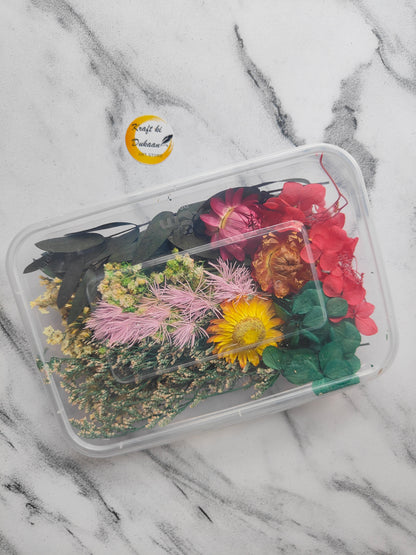Pressed dry flower box for resin art filled with colorful dried flowers and greenery