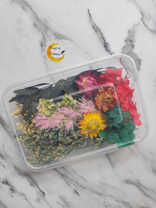 Pressed dry flower box for resin art filled with colorful dried flowers and greenery