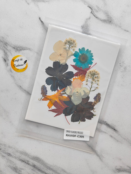 Pressed flower sheet for resin art featuring assorted colorful dried flowers and leaves in a protective sleeve