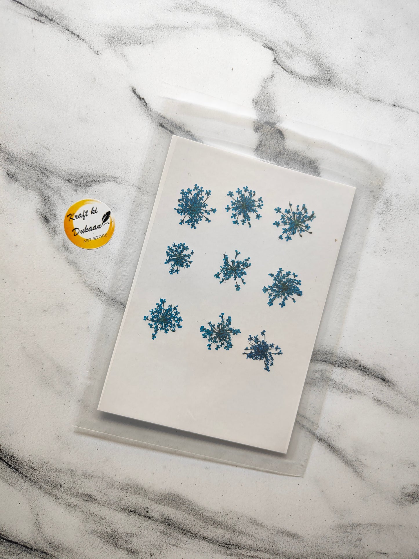Queen breath dried flowers craft supplies displayed on a marble surface, ideal for creative projects