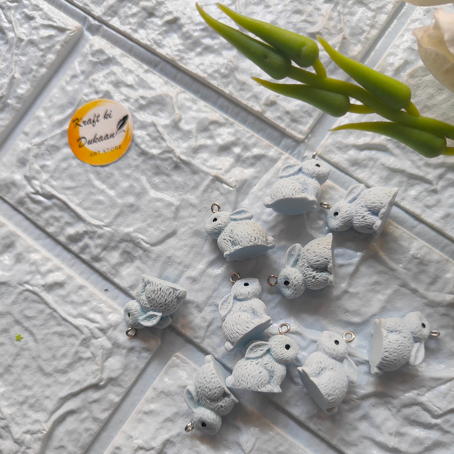 Set of rabbit charm pendants in soft blue, perfect for crafting and jewelry making