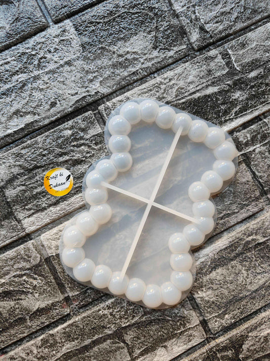 Rectangle bubble dish mould, circular bump border and cross divider lines, translucent white