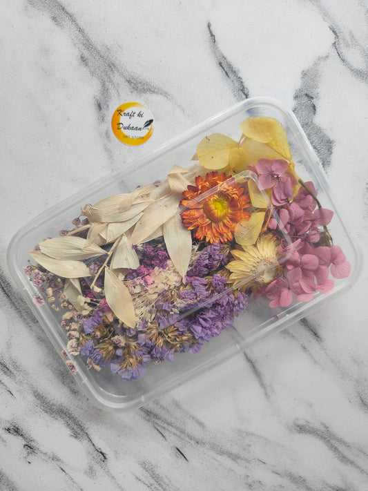 Resin art dried flower box containing various colorful dried flowers and leaves arranged beautifully