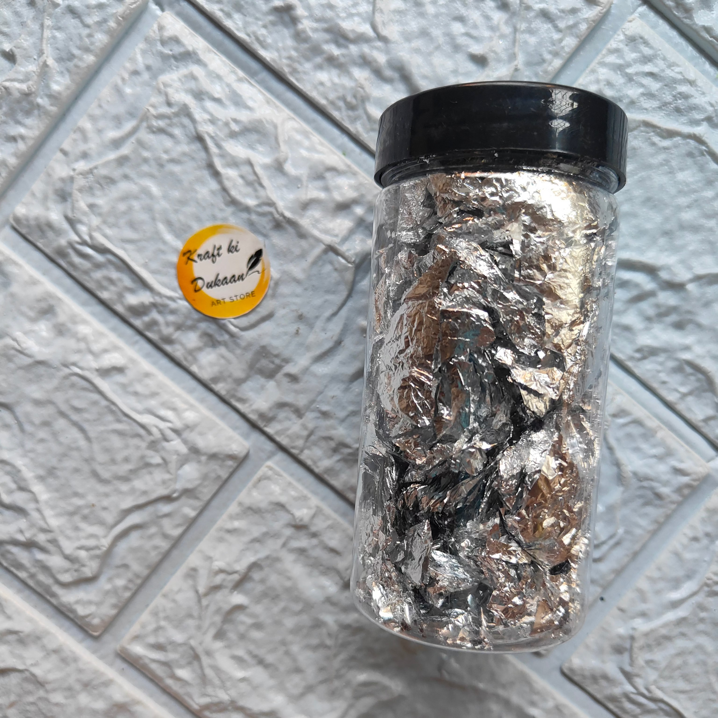 Kraft ki Dukaan Resin Art Foil Flakes in a clear jar for creative projects and decorations