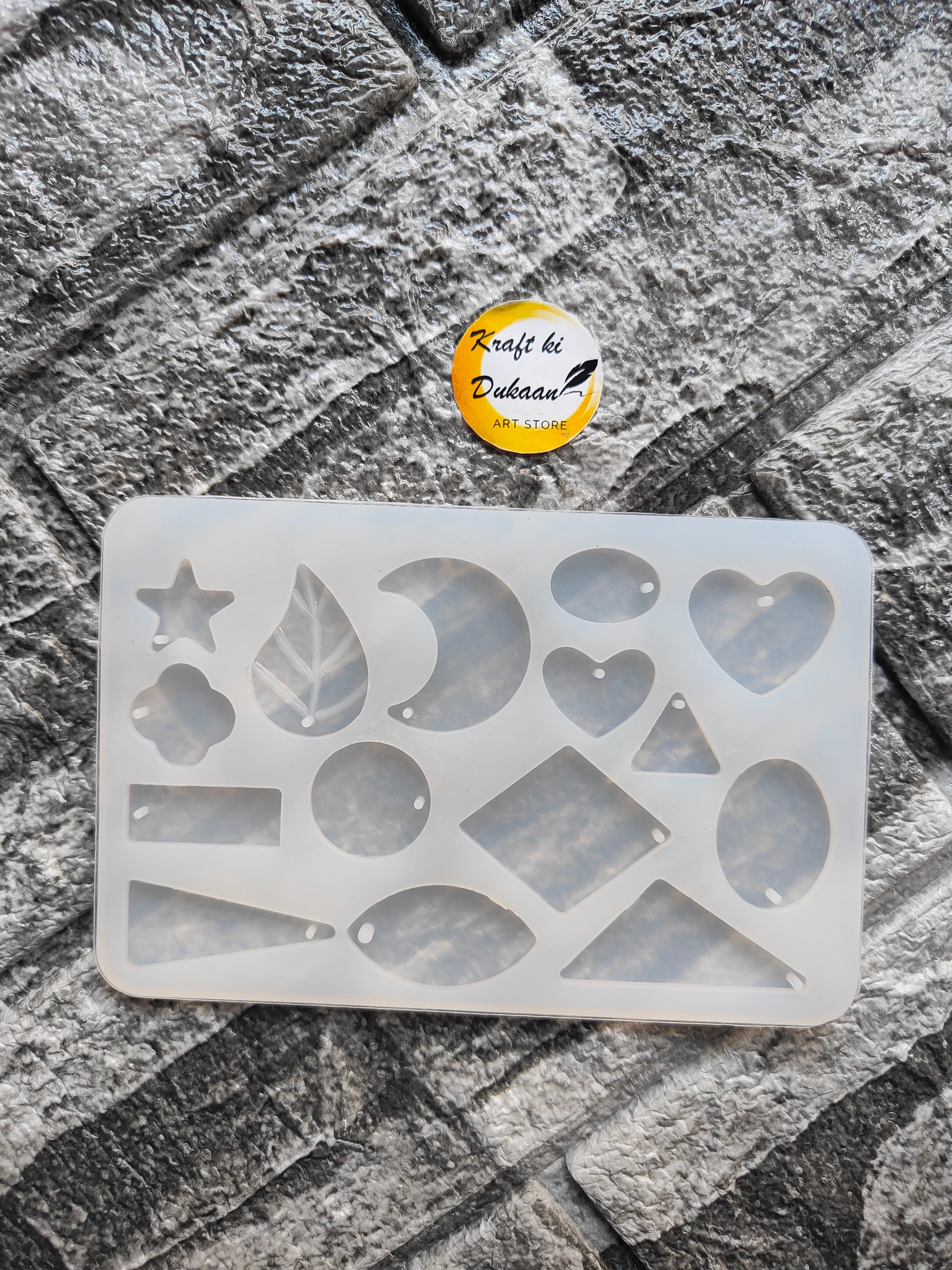 Flexible silicone resin jewellery mould featuring various shapes including hearts, stars, and leaves