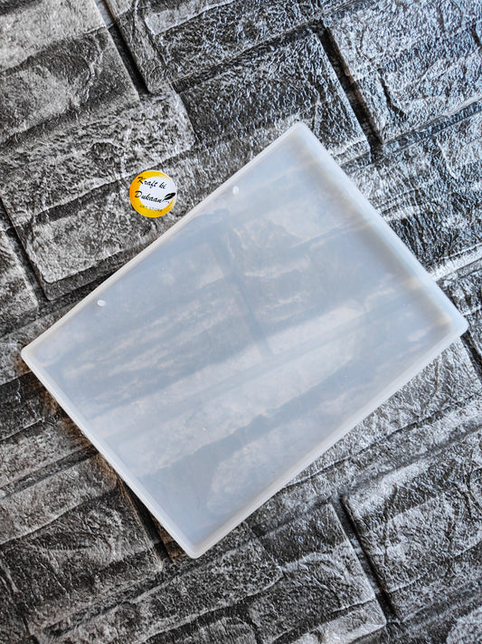 Clear rectangular resin name plate mould on textured stone background from Kraft ki Dukaan