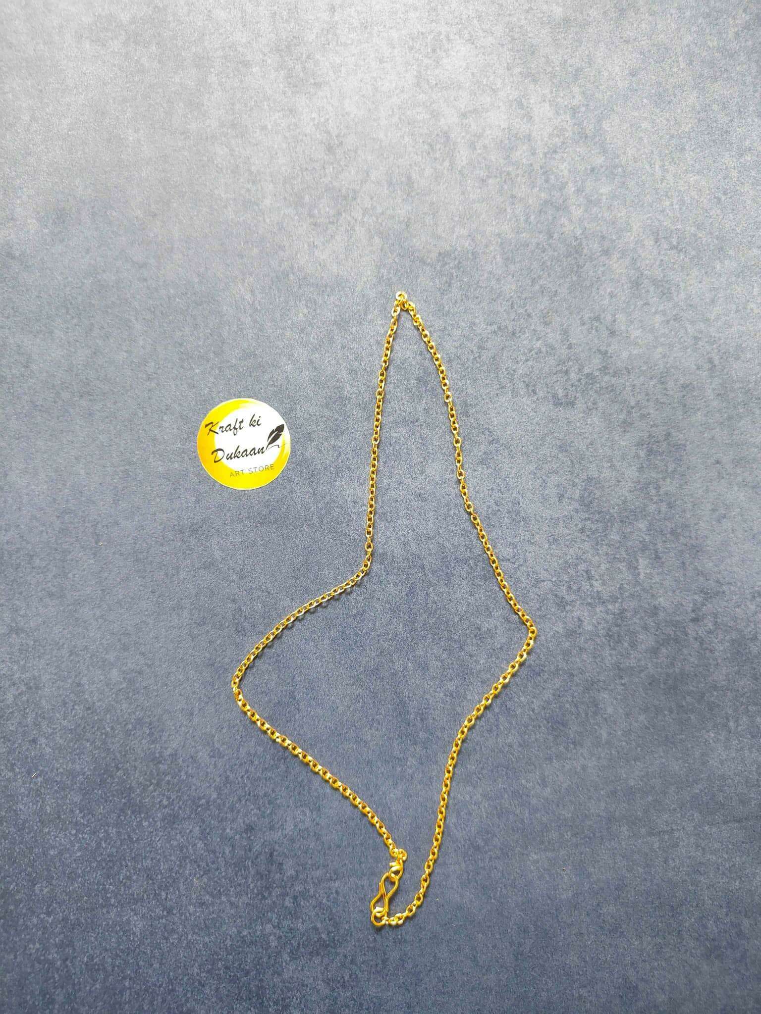 Gold short chain necklace, teardrop-style chain with clasp detail laid out