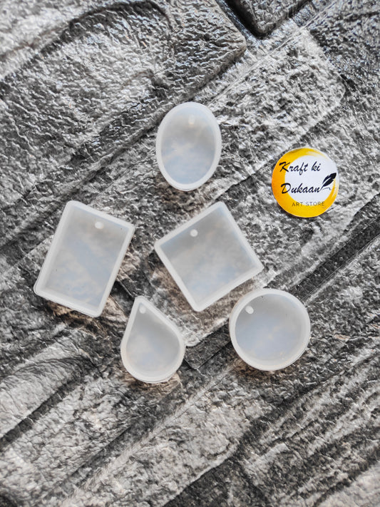 Transparent resin pendant mold set from Kraft ki Dukaan featuring various shapes for creative projects