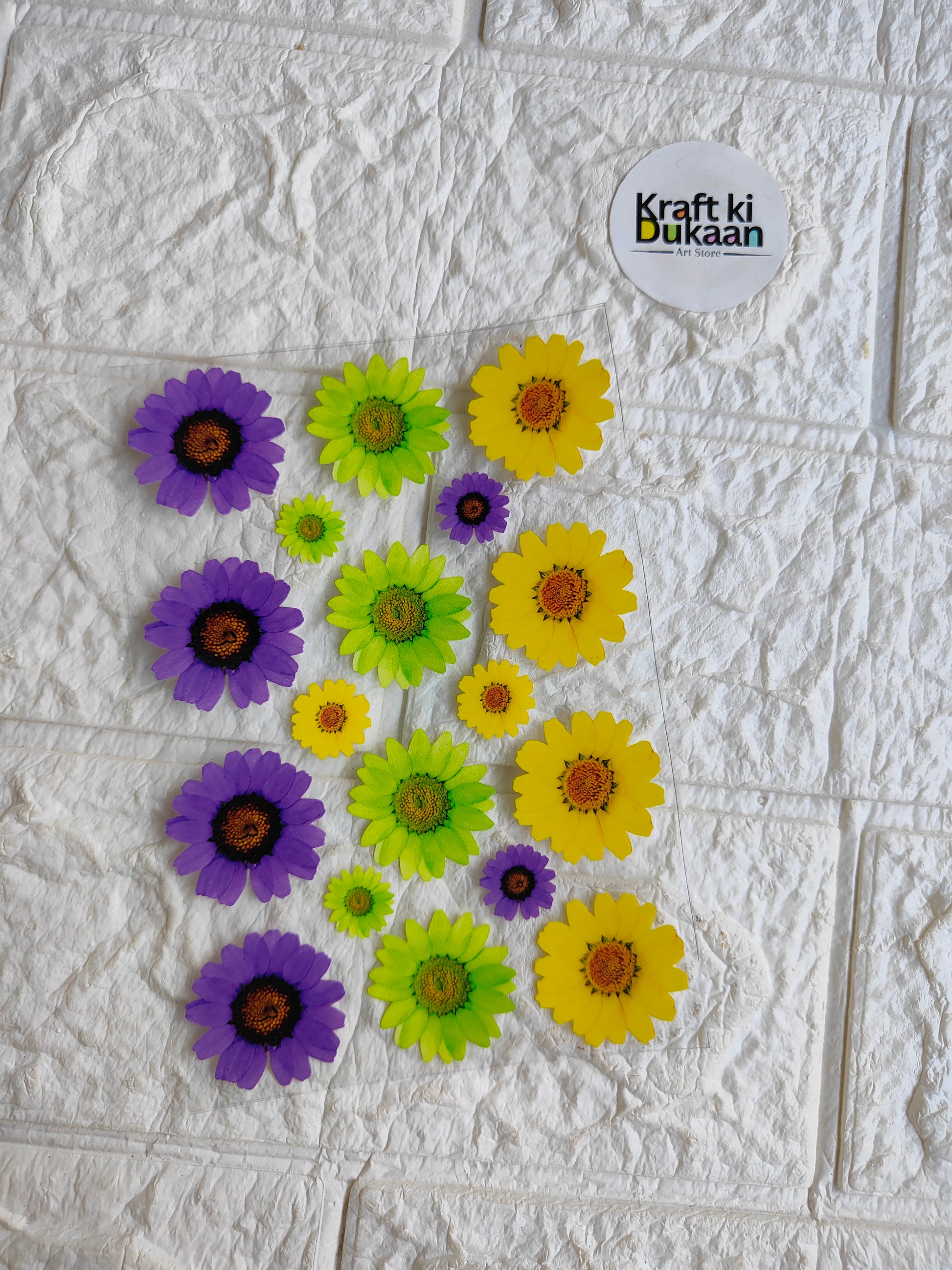 UV DTF peel-off sticker sheet with flower designs in purple, green, and yellow