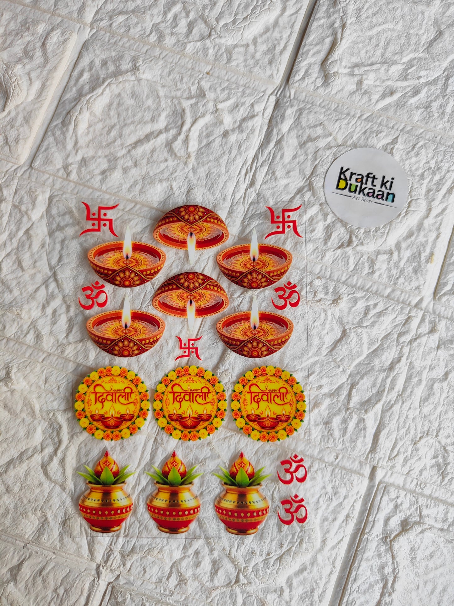 Peel-off UV DTF sticker sheet with orange and red circular diya and Om designs