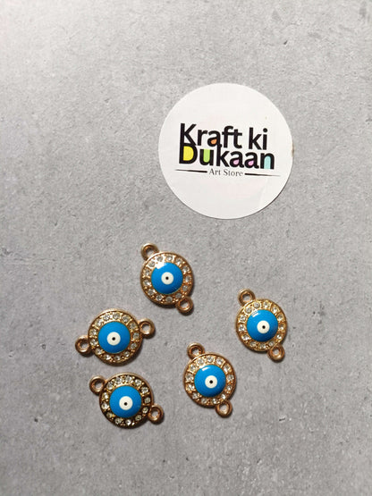 Gold-tone evil eye bracelet charms, five round blue cabochons with rhinestone halo