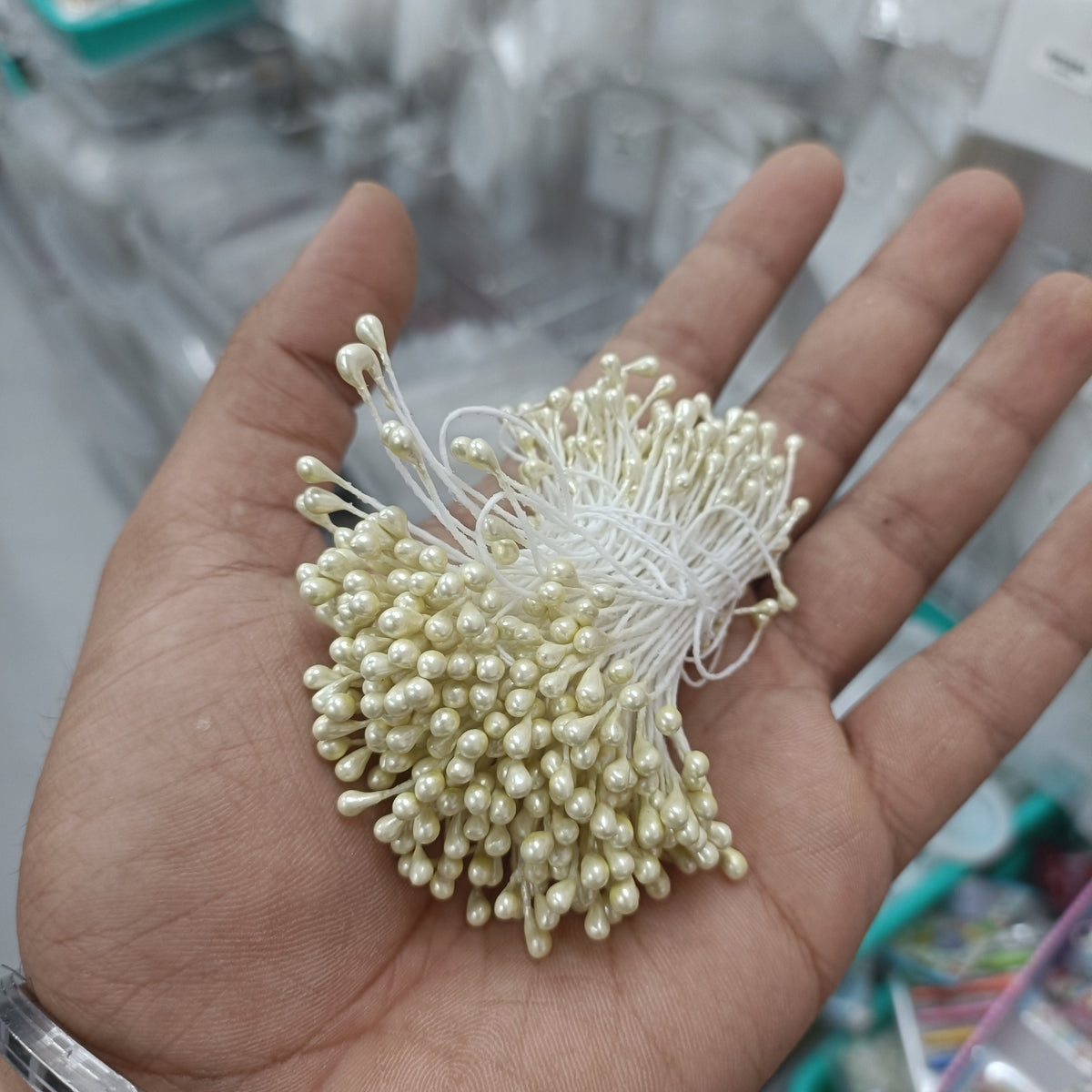 Artificial pollen bunch, cream bead-like tips with thin white filament stems