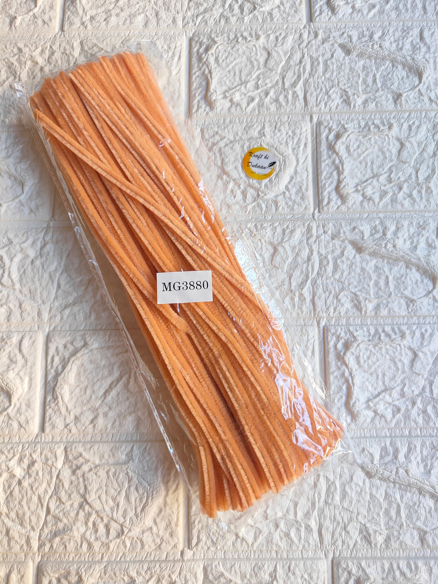 Pipe cleaner plain pack of 100, peach-orange pipe cleaners in clear wrapper