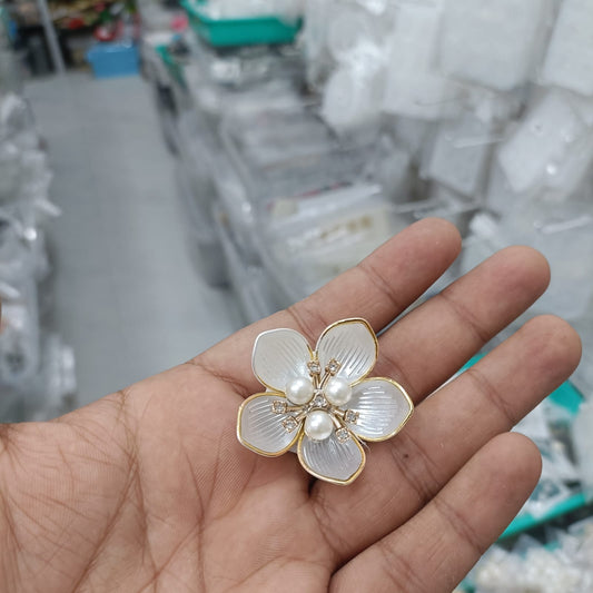 Acrylic petal pearl flower in white with pearl and rhinestone center, gold-edged petals