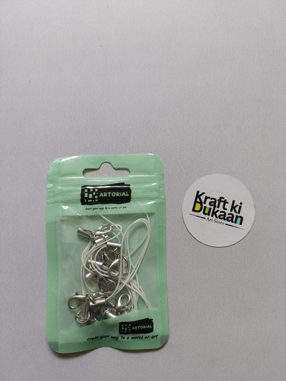 White cord keychain set with lobster clasps, metal clips on a card pack.