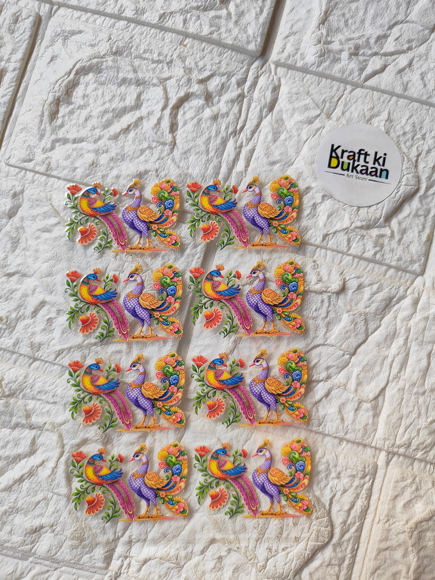 UV DTF peel-off sticker sheet with colorful peacock designs, multiple stickers