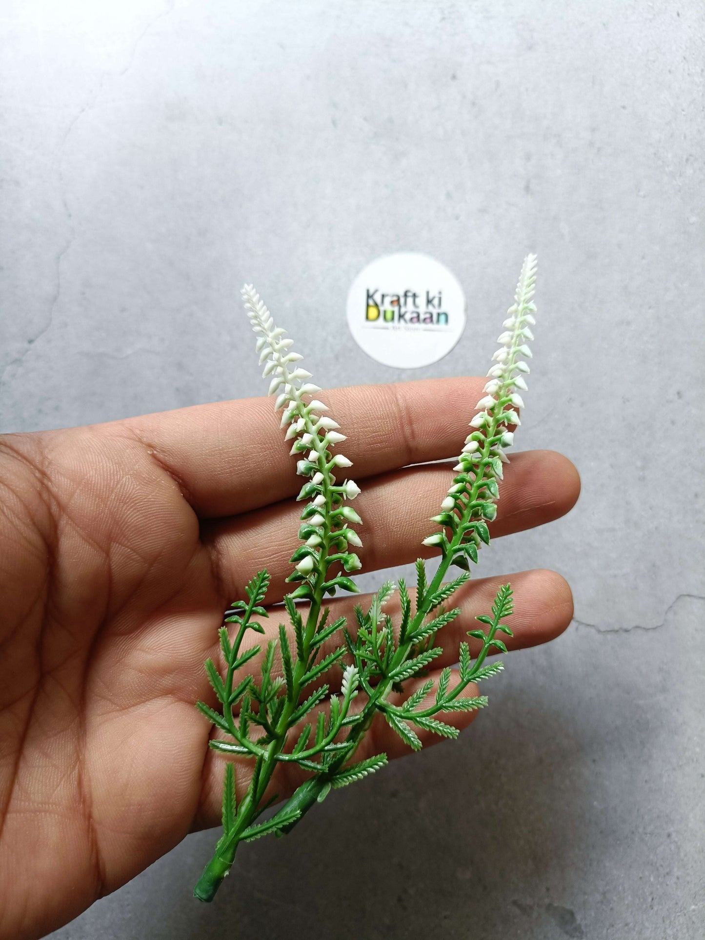 Artificial flower sprig bunch with white spike blossoms and green stems