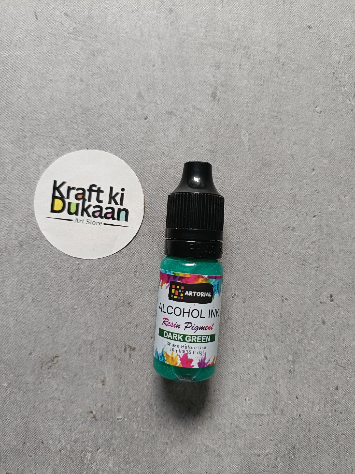 Alcohol ink bottle with black cap, dark green resin pigment label