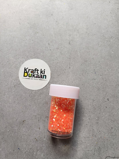 Red-orange holo glitter jar with white ribbed lid