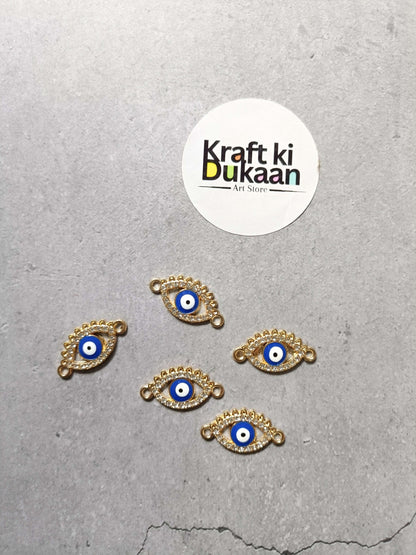 Gold-tone evil eye bracelet charms set of five, laid out
