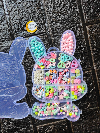 Clear heart organizer DIY bracelet bead kit with pastel beads, star charms, and elastic loops