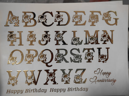 Gold embossed sticker sheet with cartoon letter icons and Happy Birthday text