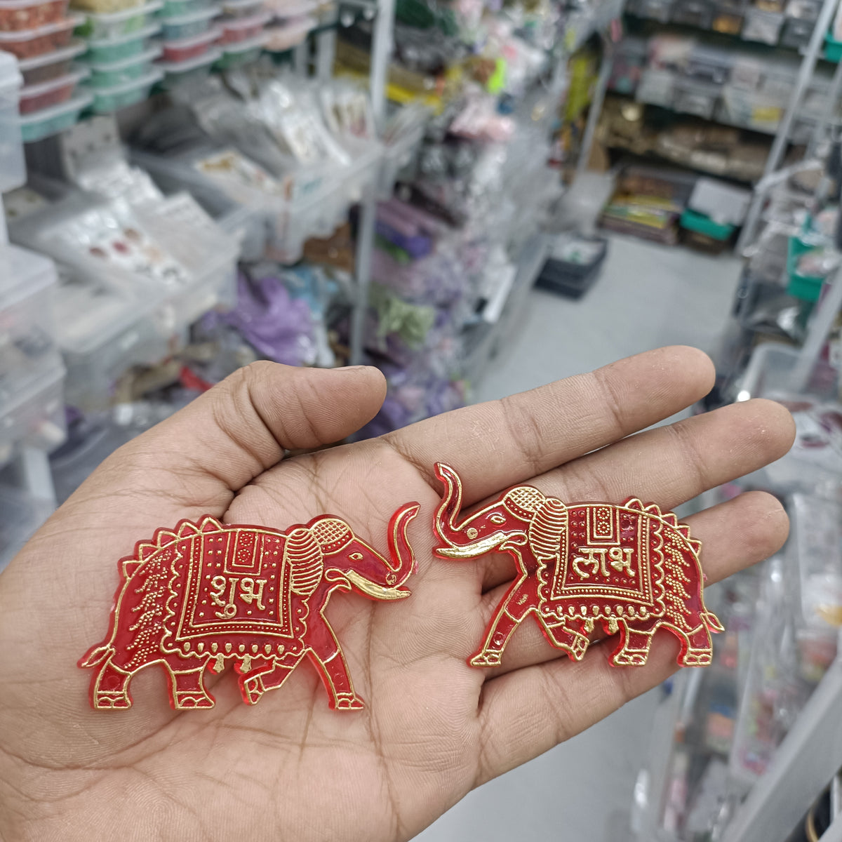 Red acrylic elephant charm pair with gold detailing, small 2-inch size