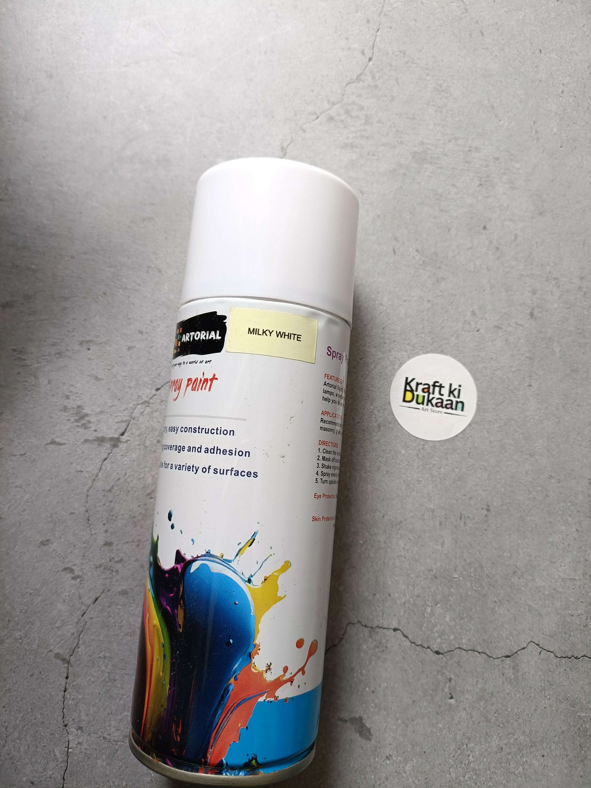 Milky white spray paint can with “MILKY WHITE” label and “Kraft ki Dukaan” sticker