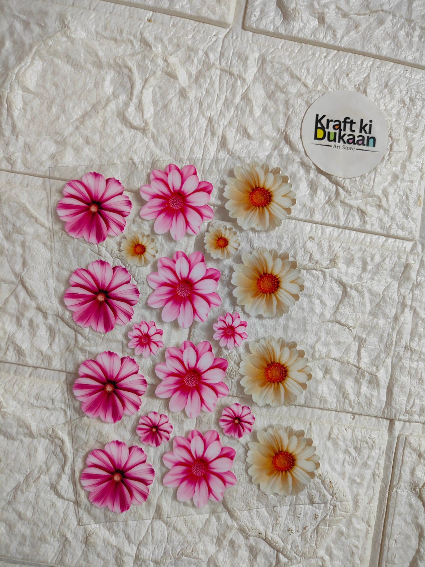 UV DTF peel-off sticker sheet with multiple pink and orange flower decals