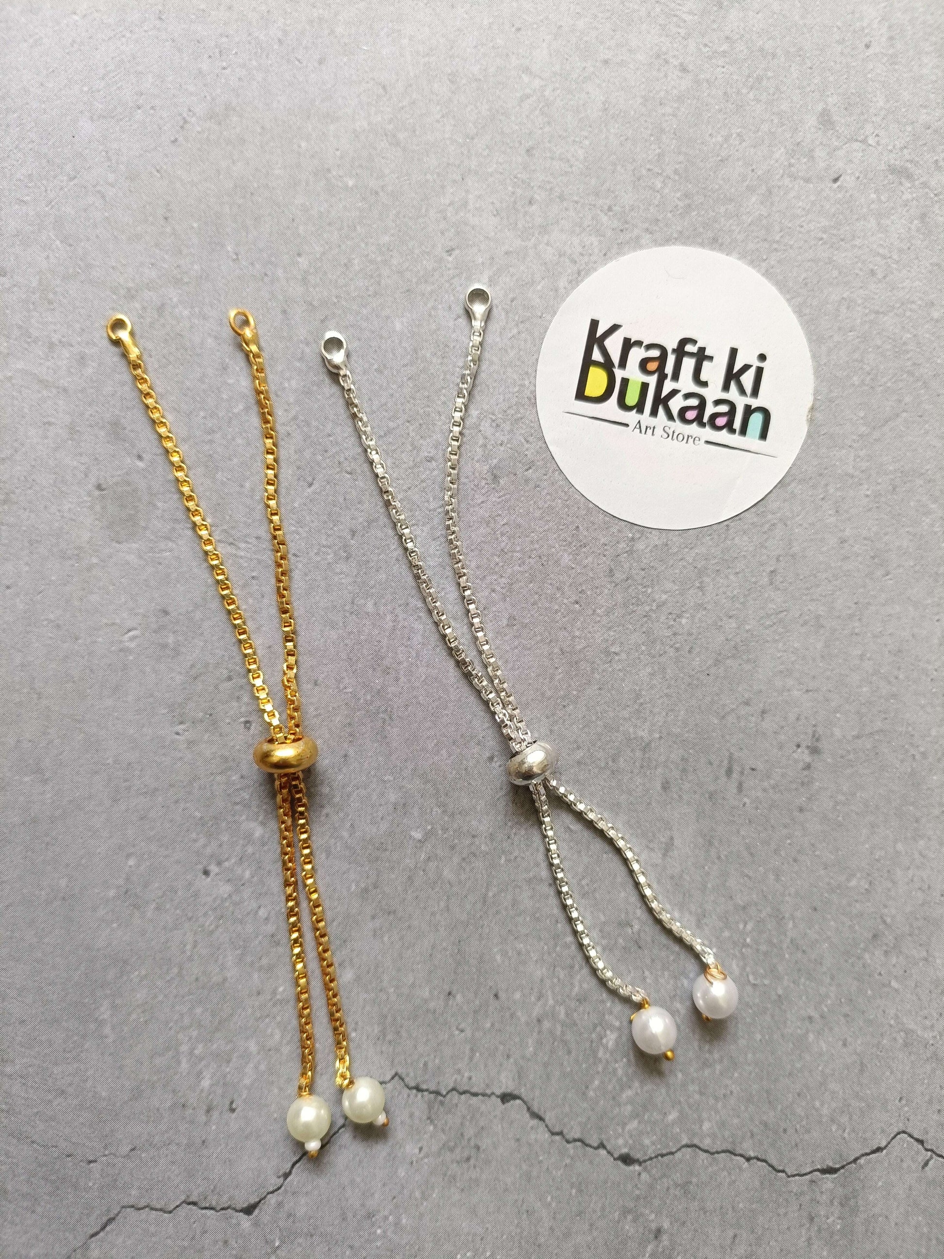 Gold- and silver-tone chain bracelet set with pearl drop charms