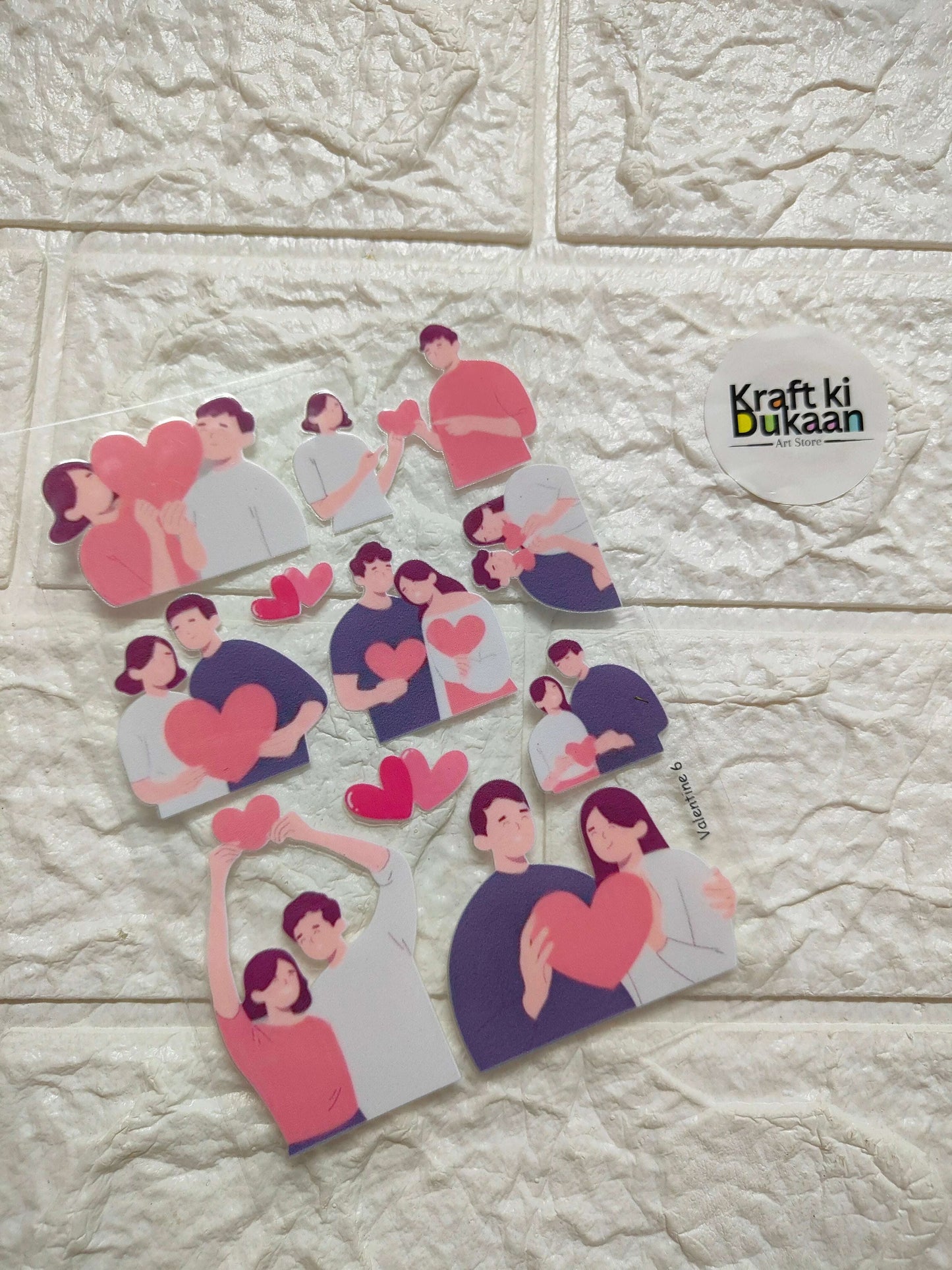 UV DTF peel-off sticker sheet with cartoon figures and pink hearts, assorted poses