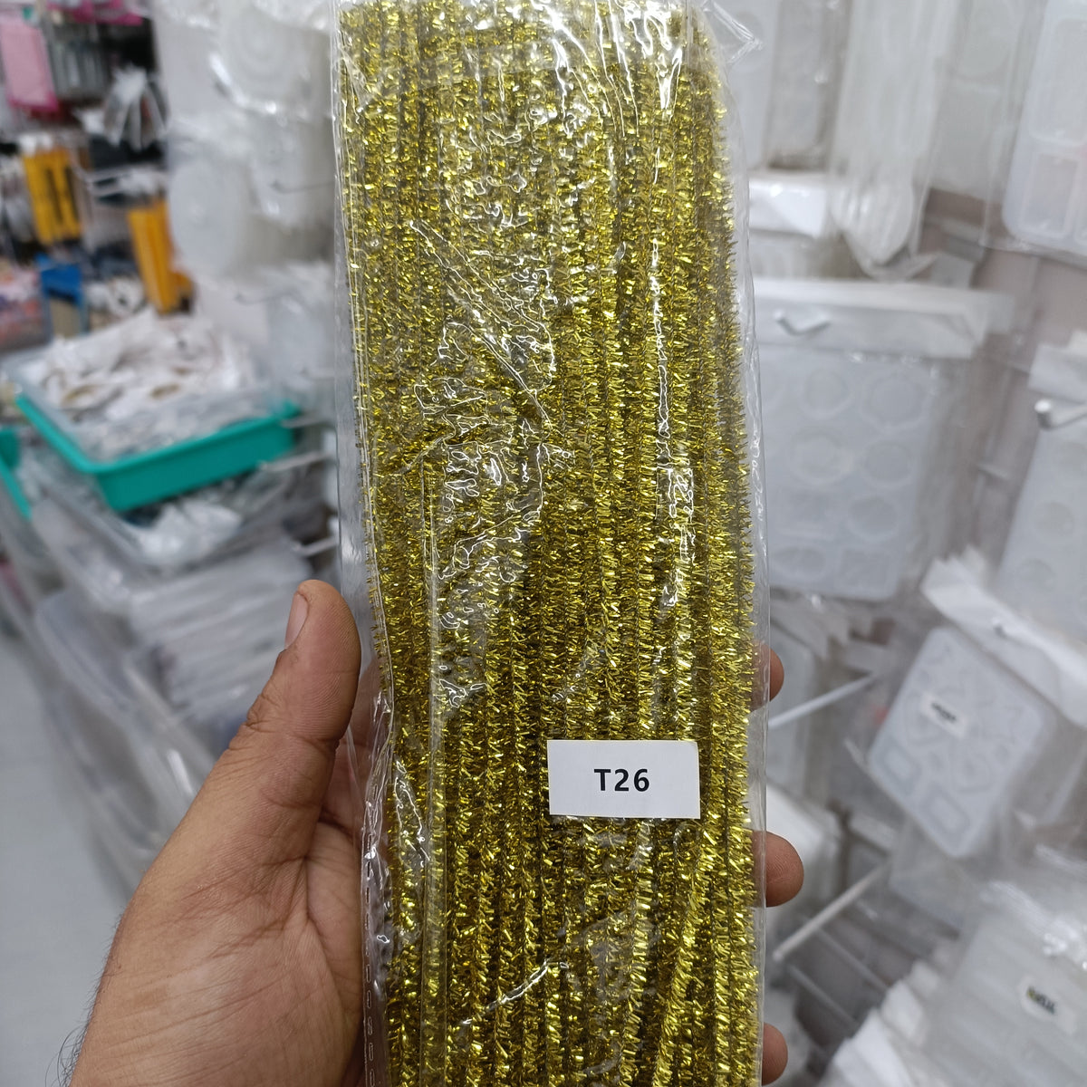 Metallic gold sparkle pipe cleaner bundle with tight coil, pack of 100 in plastic