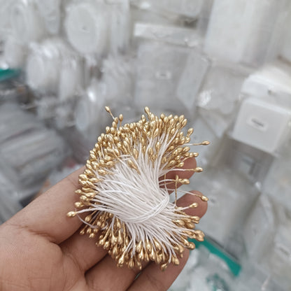 Gold artificial pollen spray with clustered bead-like florets and wire stems