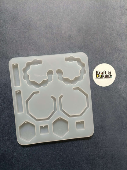 10-cavity jewelry mould, white plastic, geometric cavity shapes