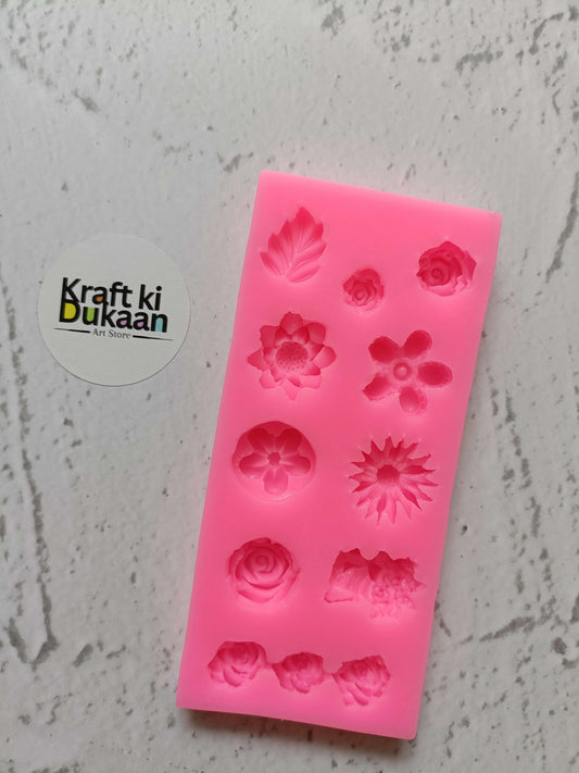 Pink silicone flower mould with 12 cavity floral designs