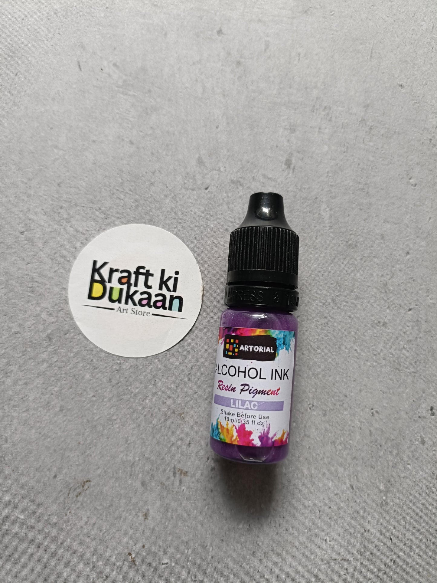 Alcohol ink bottle with black cap, lilac resin pigment label