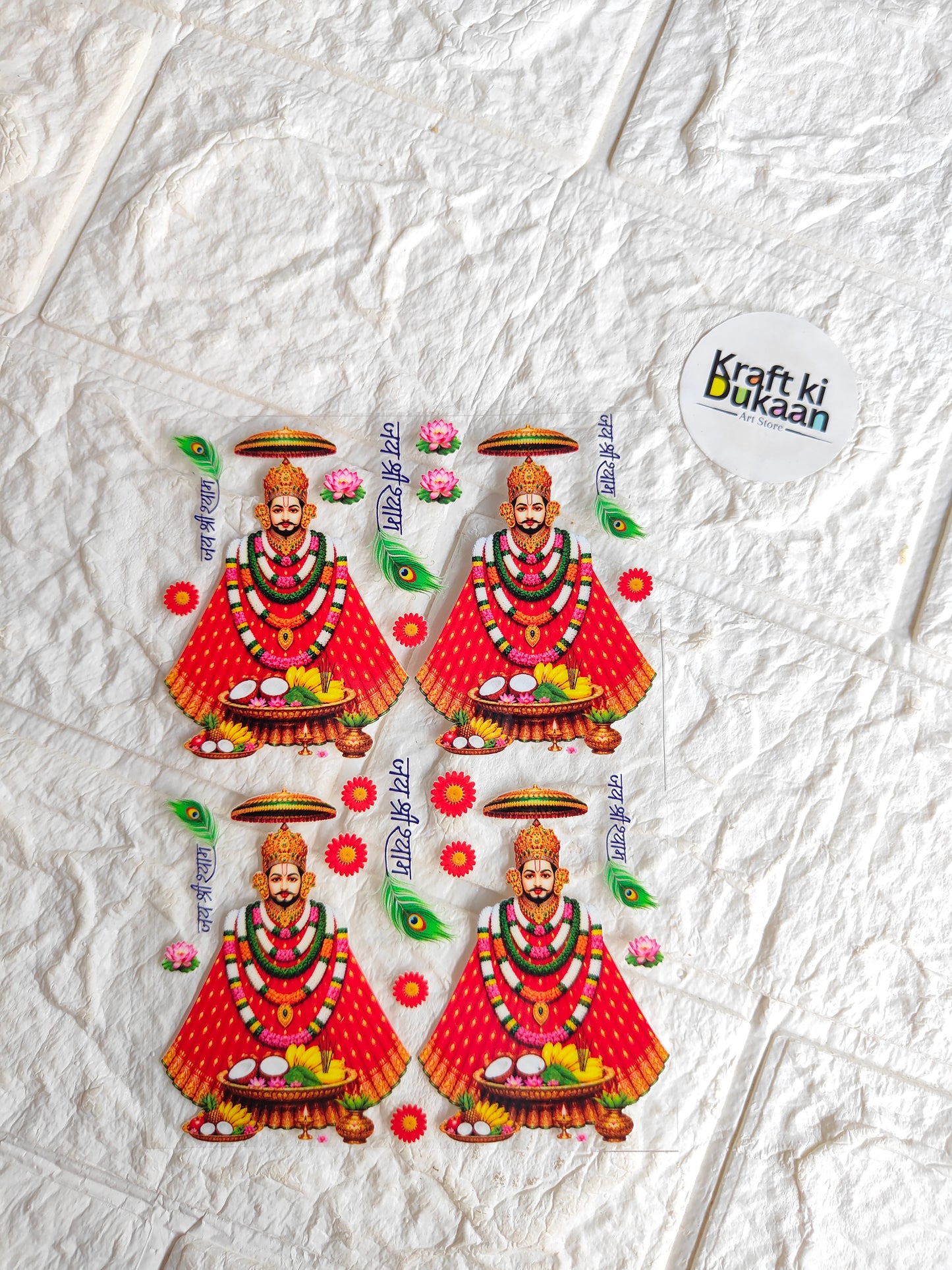 UV DTF peel-off sticker sheet with four colorful deity figures, peacock feathers, and flowers