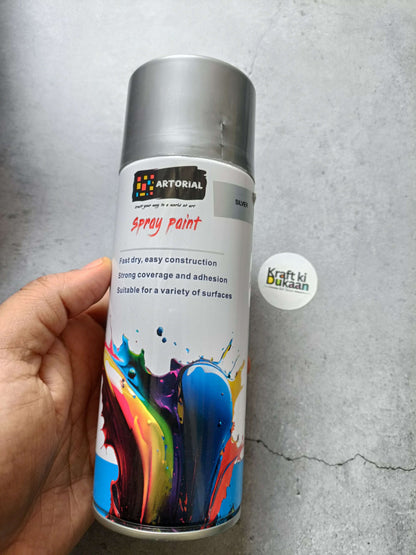 Silver spray paint can with colorful splatter label and “Kraft ki Dukaan” sticker