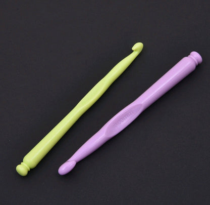 Plastic knitting needle set, lime green and light purple straight needles