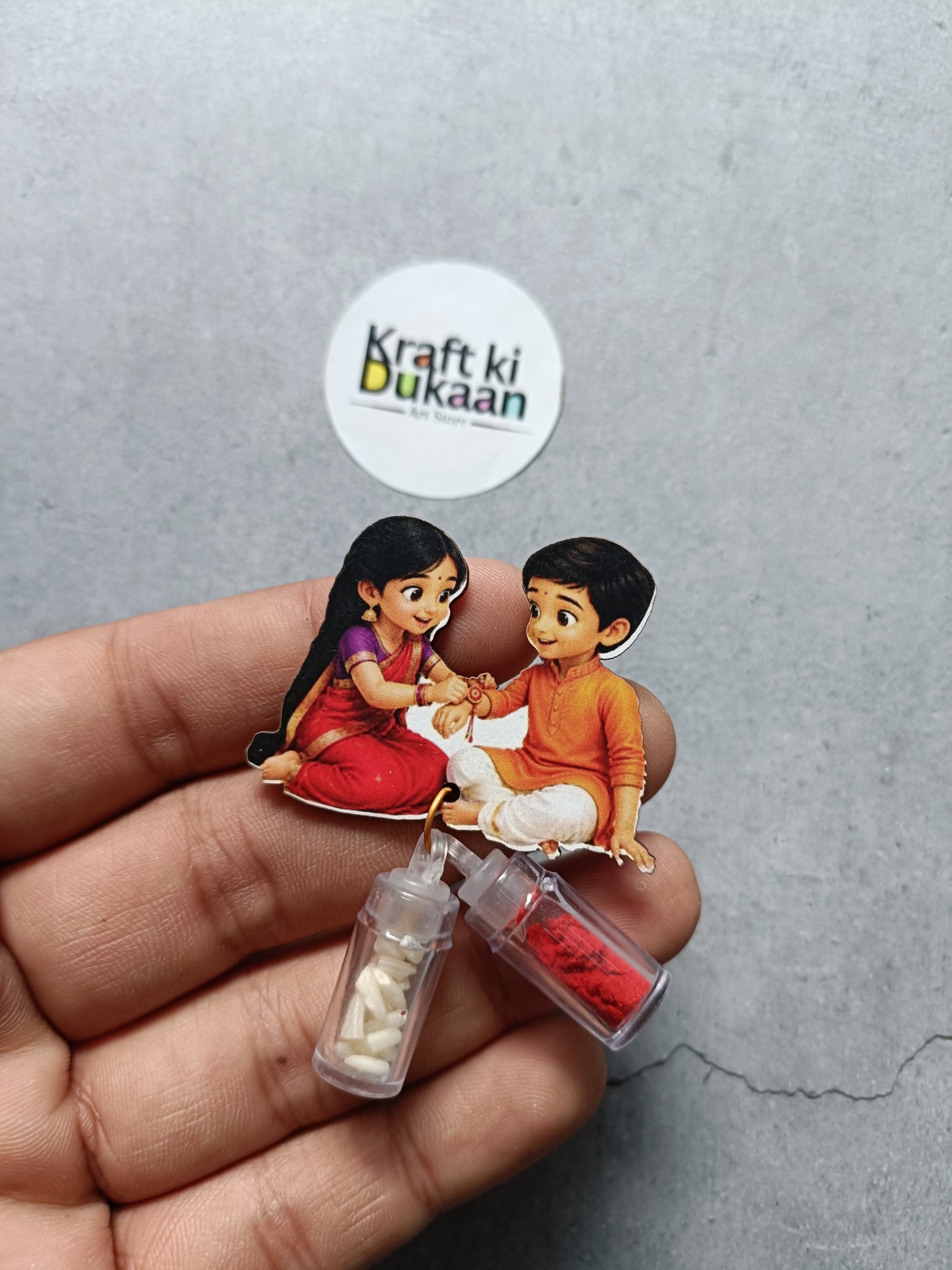 Roli and chawal bottle set with clear bottles of white and red powders, cartoon kids