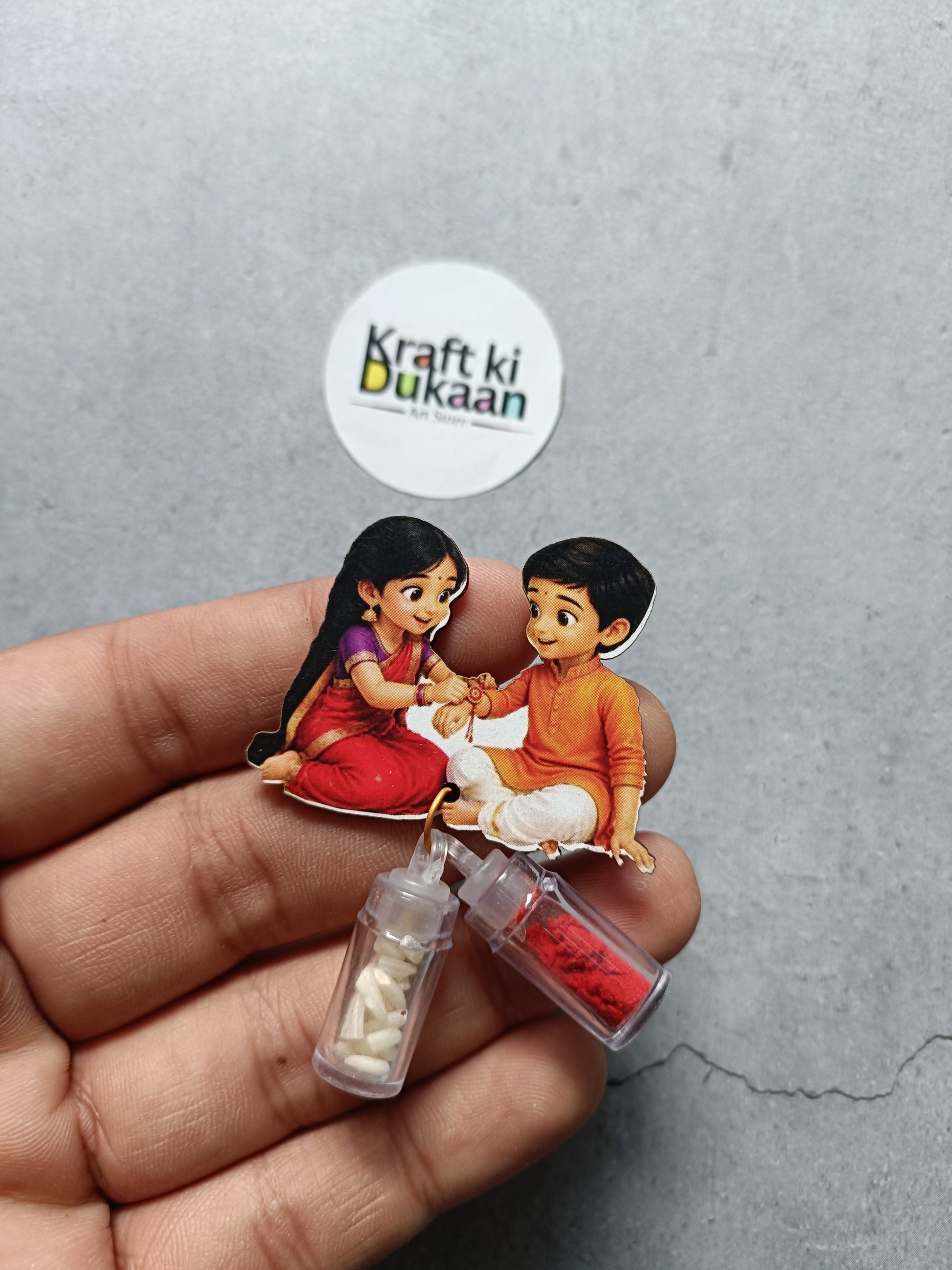 Roli and chawal bottle set with clear bottles of white and red powders, cartoon kids