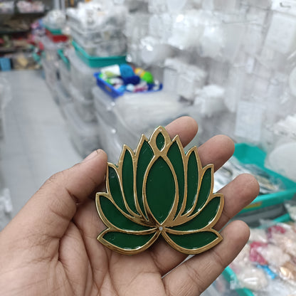 Green lotus acrylic tea light holder with gold trim, shown in hand