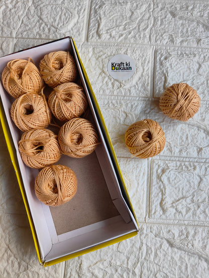 Rakhi thread roll with tan beige thread balls in open box and loose ball