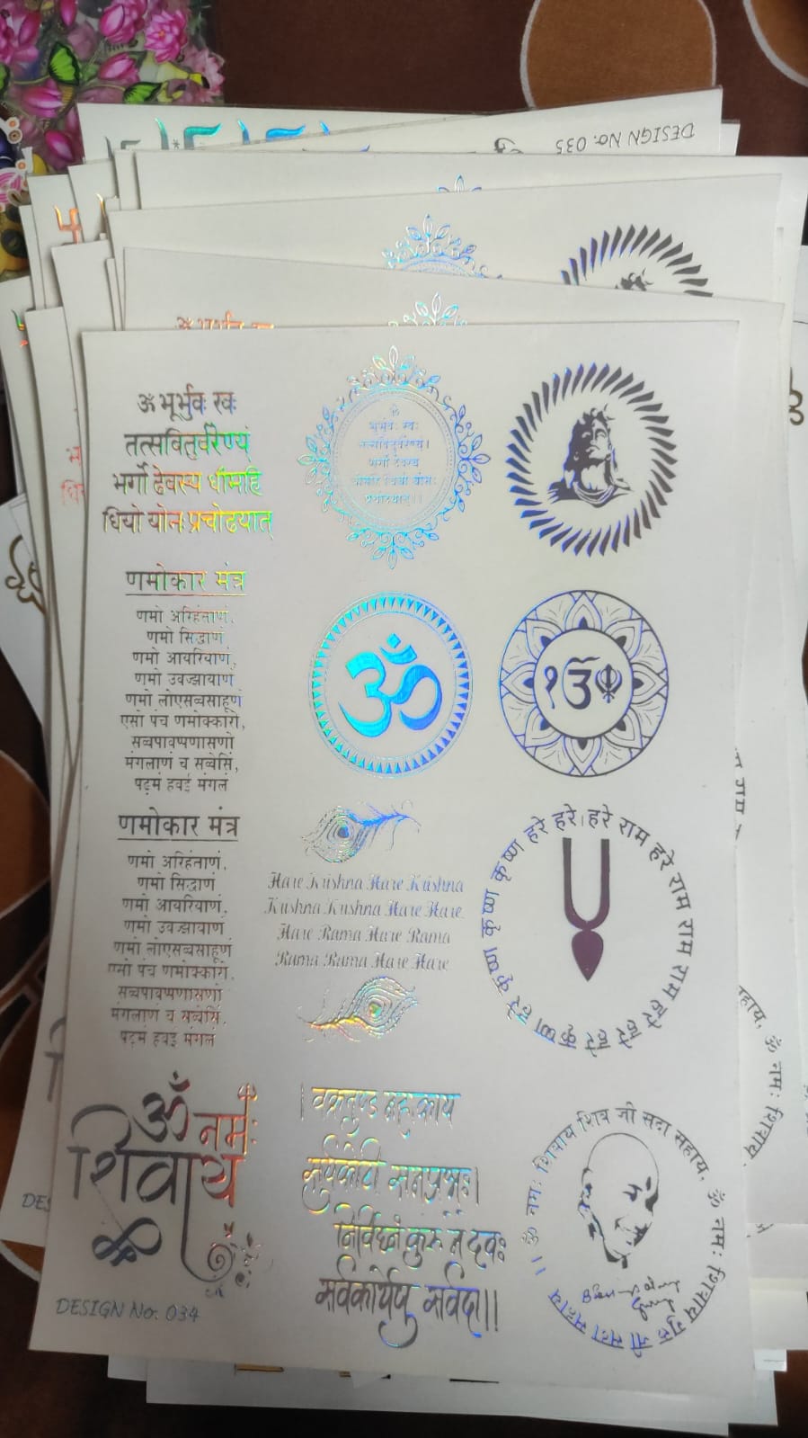 Holographic sticker sheet with circular symbols and blue Om-style decals