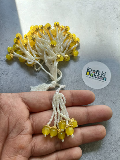 Yellow bead tassel latkan with white thread and gold details