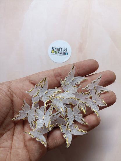 Butterfly bead pack of 25, gold-tone wing charms with white insets